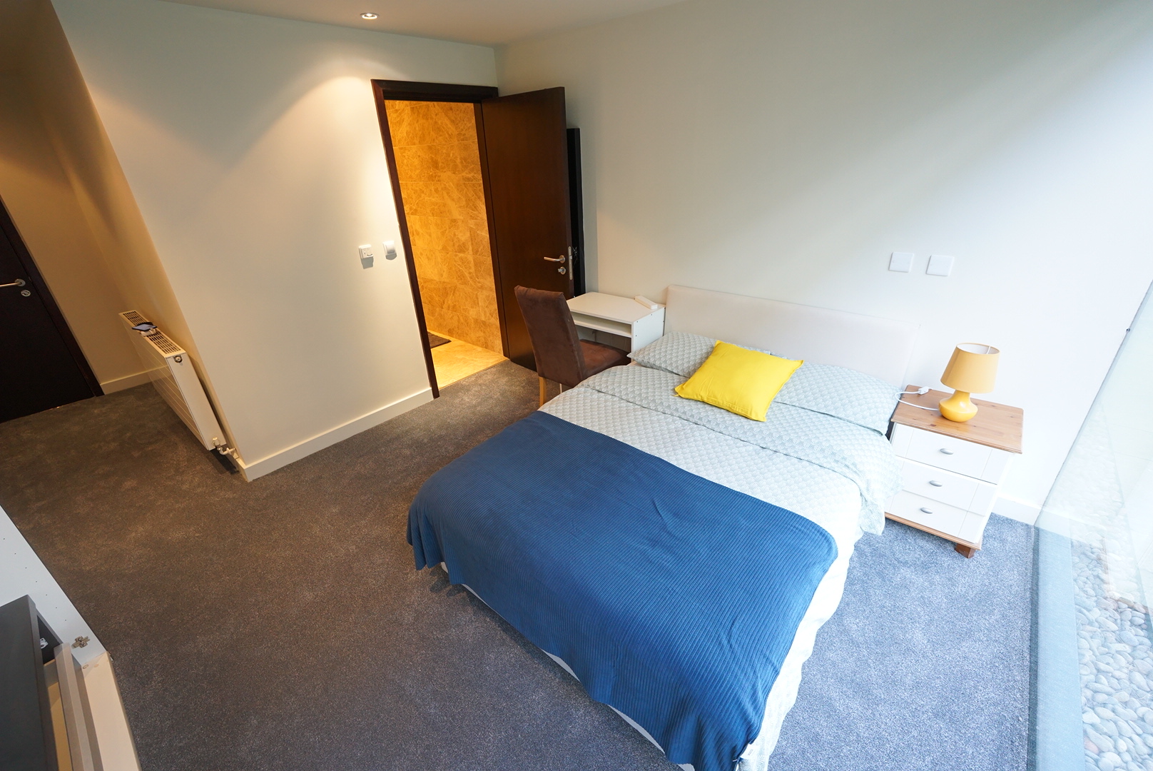 Apartment 418 private double bedroom with desk and en-suite bathroom